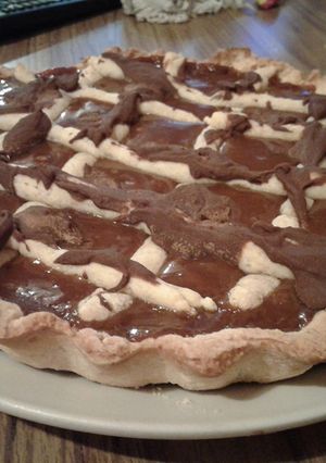 Una foto de Tarta de dulce de leche y chocolate cobertura