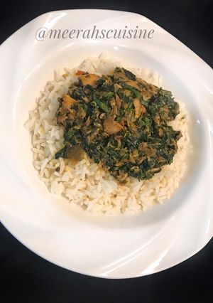 A picture of White rice and vegetable sauce.
