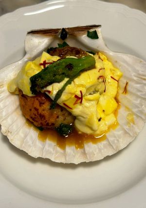 A picture of Pan-Seared Scallops with Broccoli Rabe and Saffron Cream.