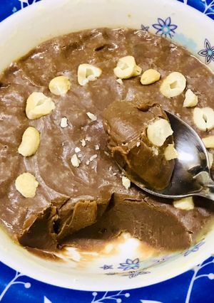 A picture of A bowl of chocolate fudge in microwave.
