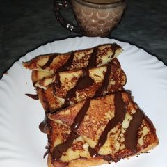 A picture of French toast with Chocolate Sauce.