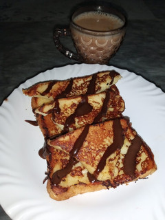 A picture of French toast with Chocolate Sauce.