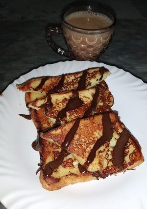 A picture of French toast with Chocolate Sauce.