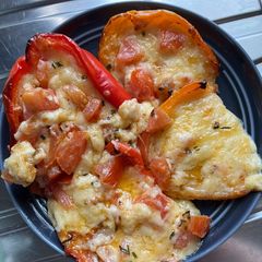 A picture of Stuffed Peppers with Cheese and Tomato Filling.