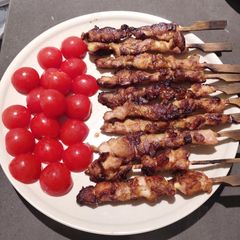 A picture of Grilled Chicken Skewers with Cherry Tomatoes.