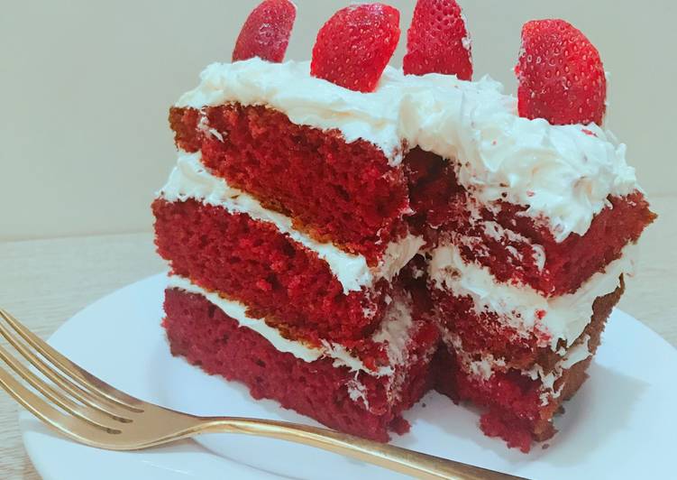 Red velvet cake with coconut frosting and strawberry toppings