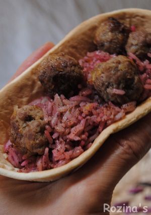 A picture of Sumac-beetroo rice with meatballs.