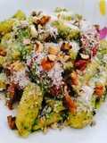 Strascinati con pesto di rucola e pomodorini e noci