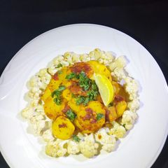 A picture of Garlic spicy potatoes with stir-fry cauliflower.