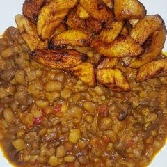 A picture of Spicy mashed beans with fried plantain.