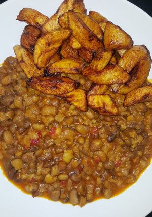 A picture of Spicy mashed beans with fried plantain.