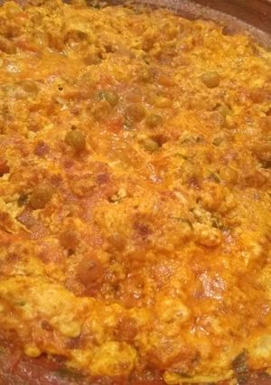 A picture of Tagine with Only Three Ingredients: Eggs, Tomatoes, and Peas.