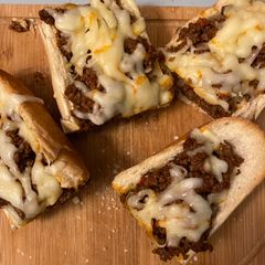 A picture of Sloppy joes stuffed french bread.