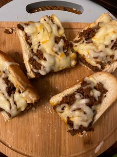 A picture of Sloppy joes stuffed french bread.