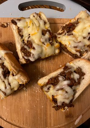 A picture of Sloppy joes stuffed french bread.