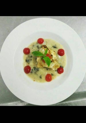 A picture of Pan Fried Chicken with Mushroom Veloute Sauce.
