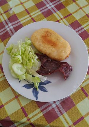 Una foto de Arepa parmesana con relleno de manchego
