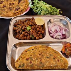 A picture of Coriander Thepla and Black Chickpeas Dry Sabji.