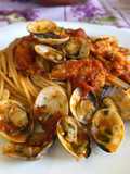 Spaghetti con Vongole, Gamberoni sfumati al Cognac e Pomodorini