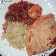 Beef stew, cabbage and chapati A picture of Beef stew, cabbage and chapati.