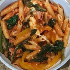 A picture of Penne pasta with #seasonsupply spinach, onions and tomatoes.