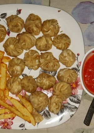 A picture of Boil Momo's, fried fingers chips with garlic chutney.