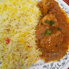 A picture of Fried rice with dahi chicken.