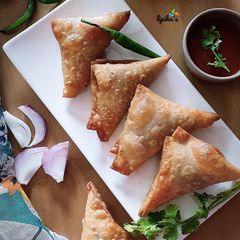 A picture of Poha onion triangle samosa.