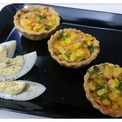 A picture of Baked Corn chaat.