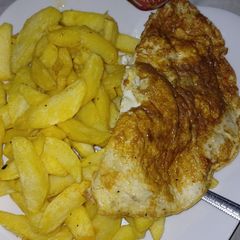 A picture of Chips,fried egg and sweet n chili sauce.