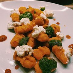 A picture of Carrot-ricotta gnocchi with mint pesto and hot honey 🍯 🥕.