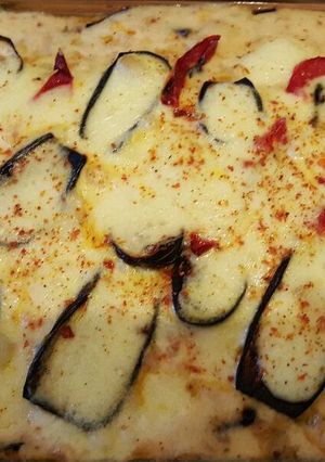 Una foto de Moussaka con humita