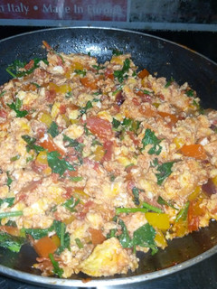 A picture of Scrambled eggs with vegetables.