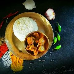 A picture of Bengali chicken Curry or Murgir jhol.