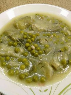 Una foto de Alcachofas con guisantes