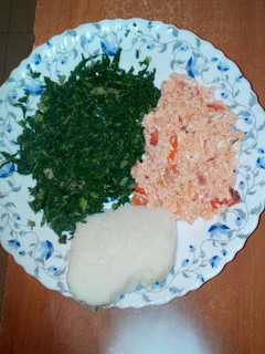 A picture of Fried eggs, served with spinach and ugali.