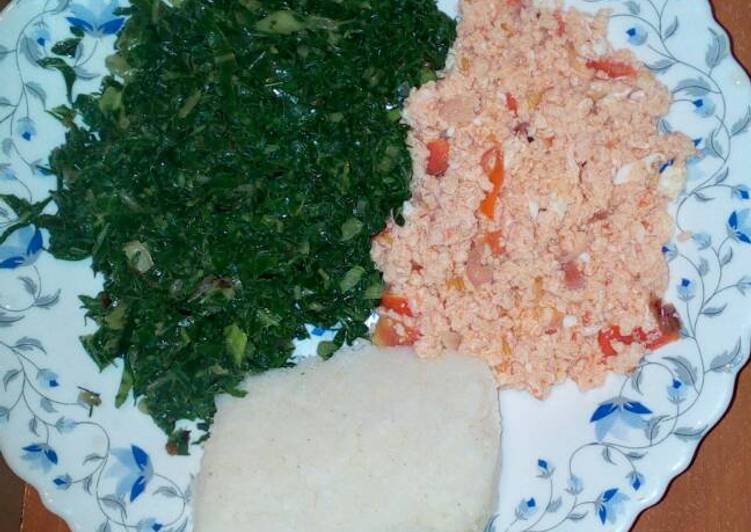 Fried eggs, served with spinach and ugali