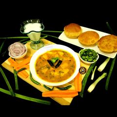 A picture of Bedmi Poori And Masala Potato Gravy.