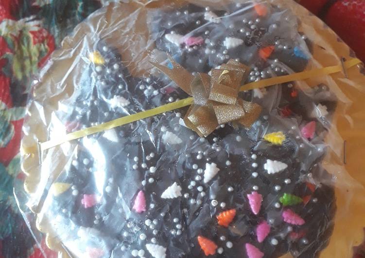 Homemade dark chocolate  coated with  colourful  chocolate sprinkles