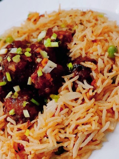 A picture of Veg Manchurian with schezwan rice.