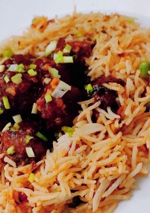 A picture of Veg Manchurian with schezwan rice.