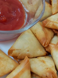 A picture of Mini Chicken cheese samosas.