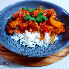 A picture of Sweet and sour chicken with rice.