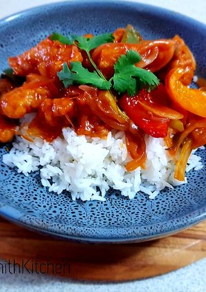 A picture of Sweet and sour chicken with rice.