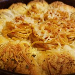 A picture of Italian Garlic Bread Bombs With Toasted Spaghetti.