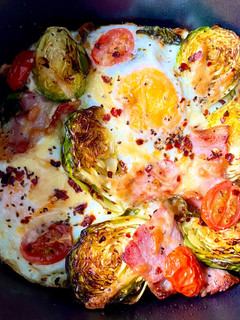 A picture of Baked egg bacon brussel breakfast.