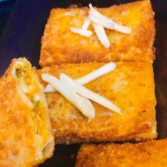 A picture of Chicken Cheese Chikki Mikki.
