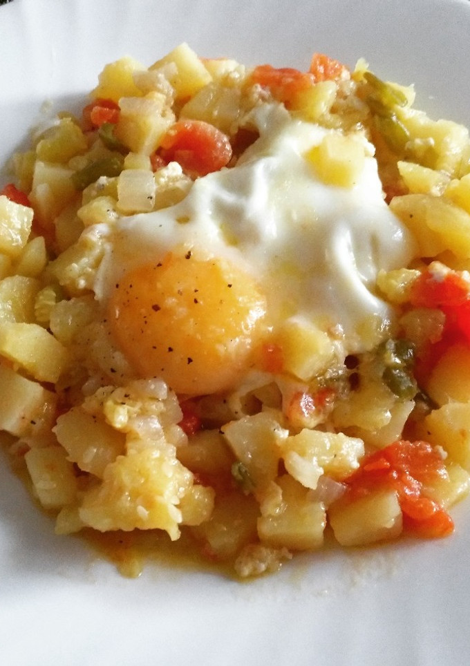 Una foto de Huevos al pisto