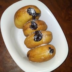 A picture of Fluffy chocolate filled Doughnuts.