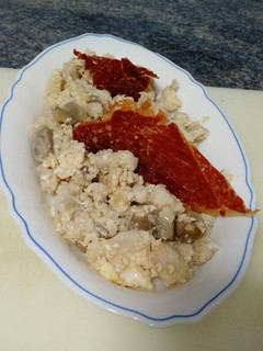 Una foto de Tapa revuelto merluza con champi
